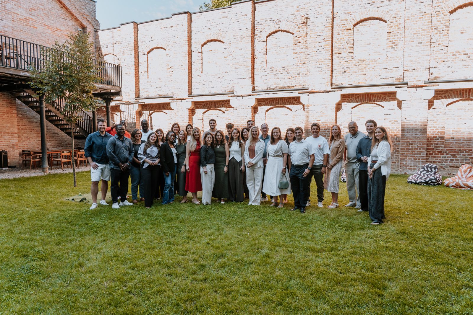 The team and guests together outside