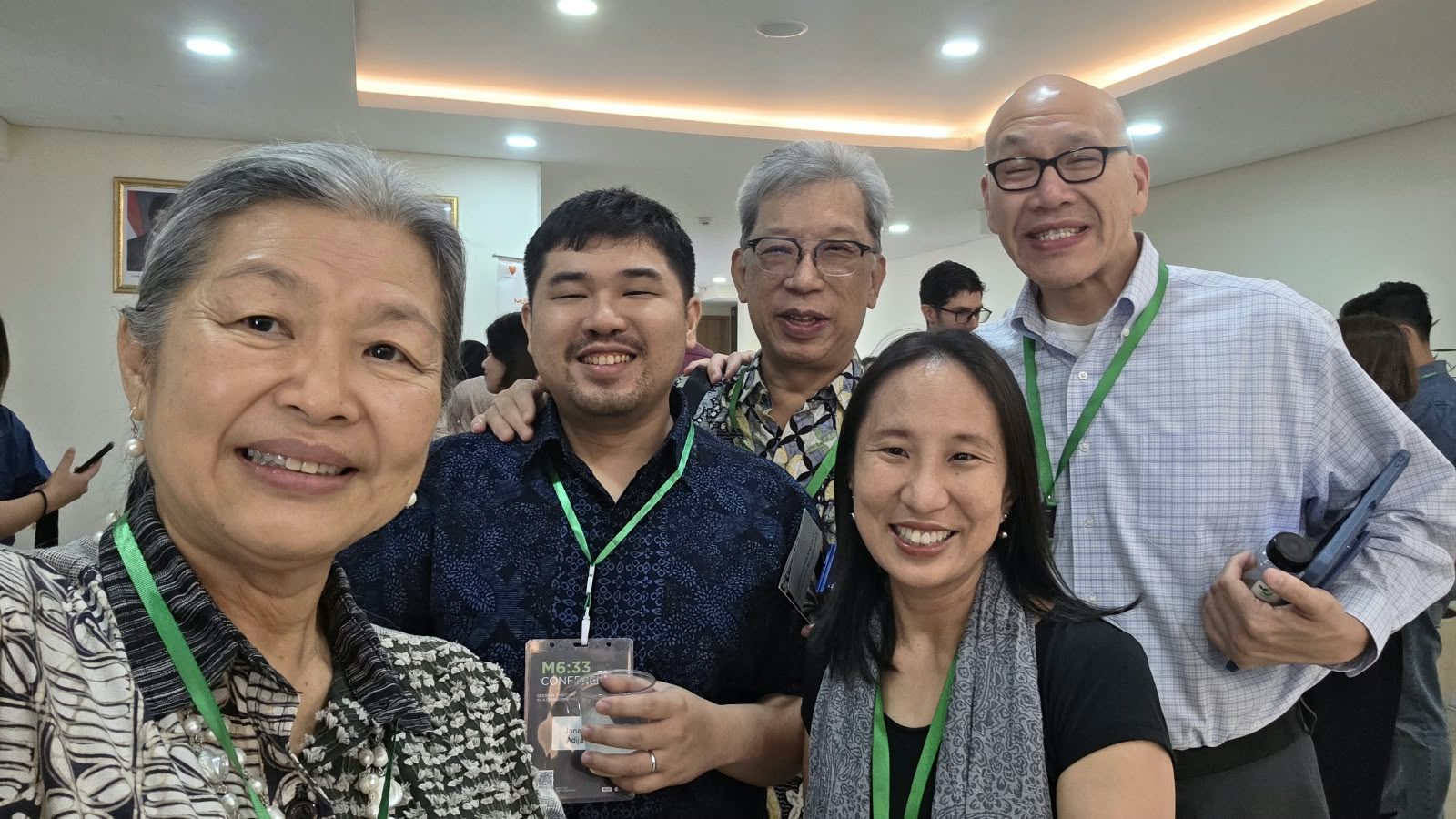 Friends smiling together at the conference