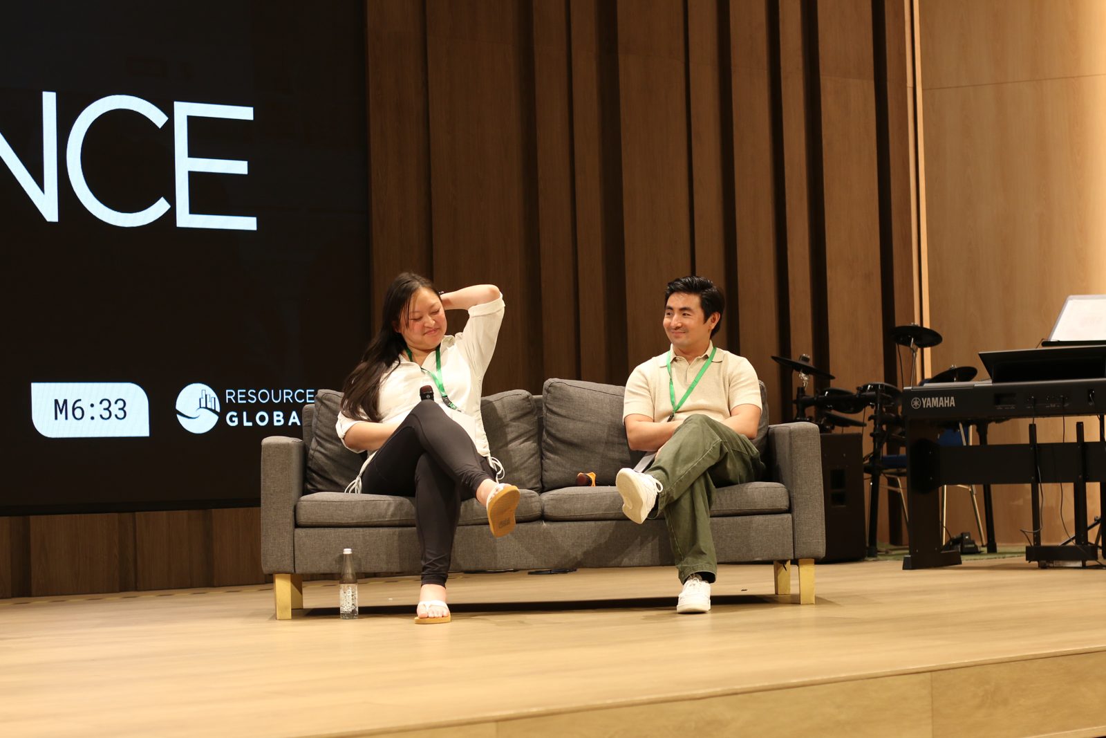 A panel conversation on stage at the conference
