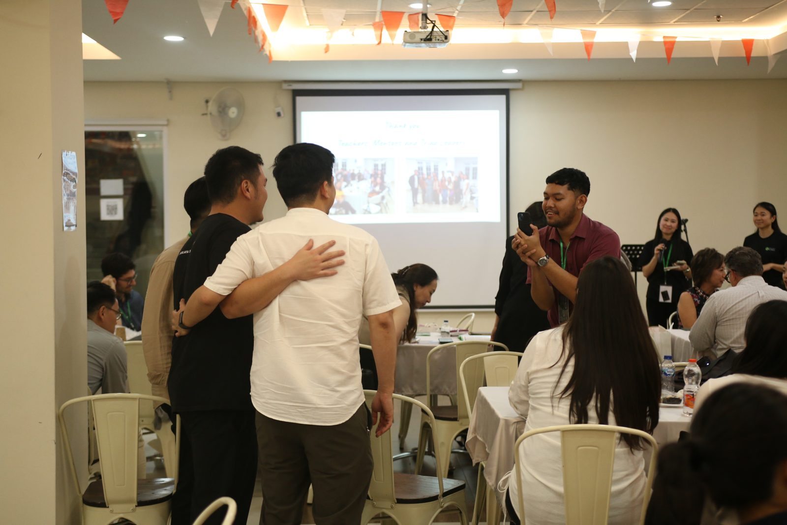 Guests praying together at the gathering