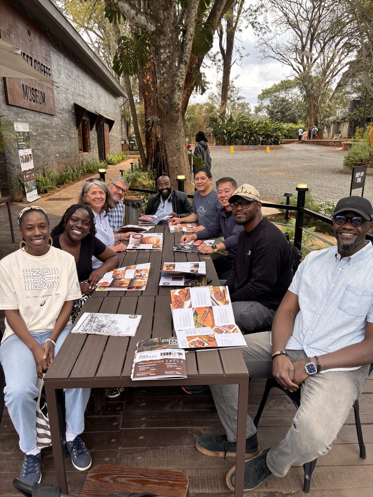 The team around a table outside