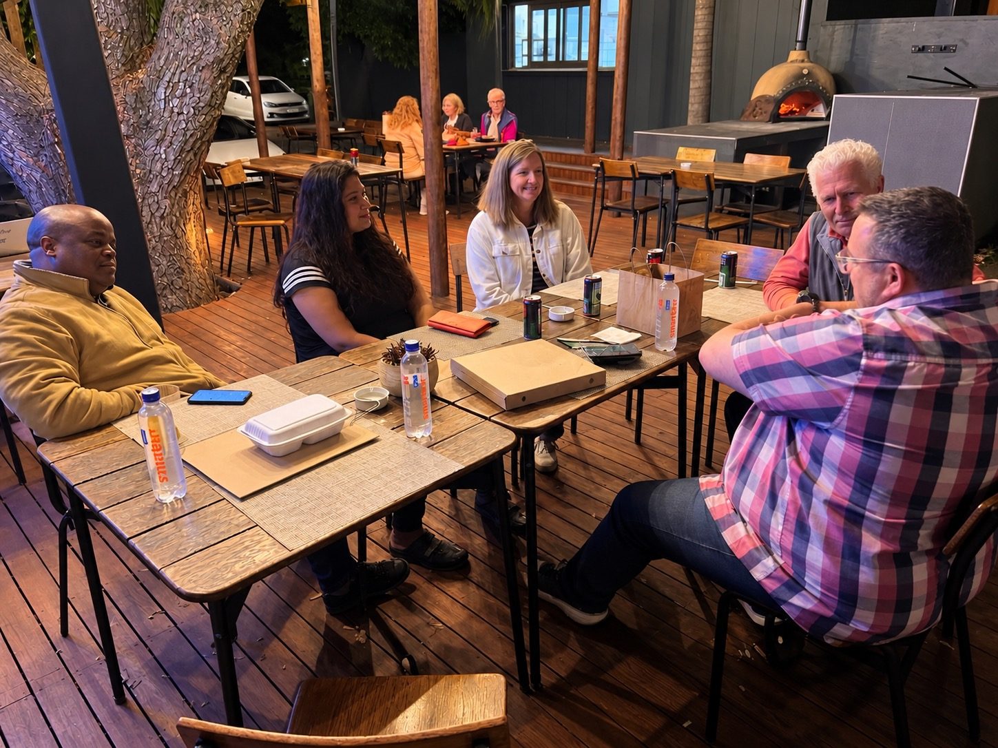 Guests around a table talking