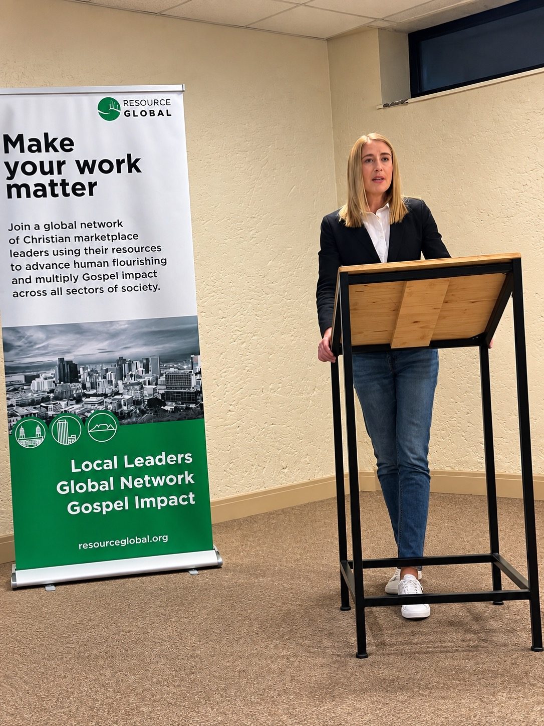 A speaker beside the Make Your Work Matter banner
